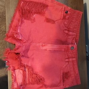 Red distressed shorts